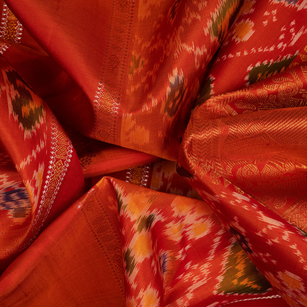 Clouseup of Handwoven Orange borderless Ikat Kanjivaram silk Saree