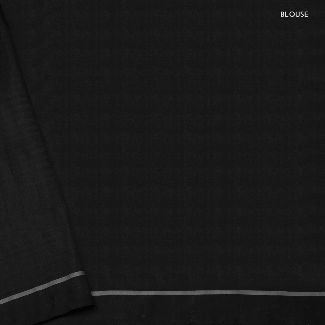 Blouse closeup of a Black double Ikat saree with striped body.