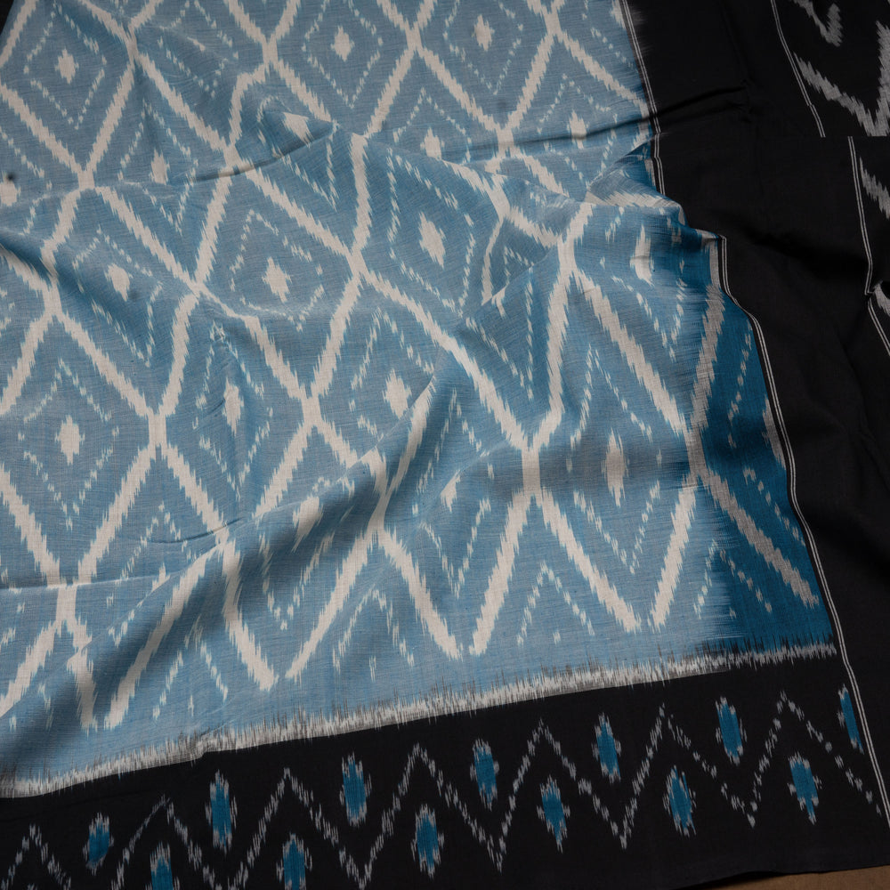 Closeup of Handwoven sky blue with maroon pallu ikkat cotton Saree