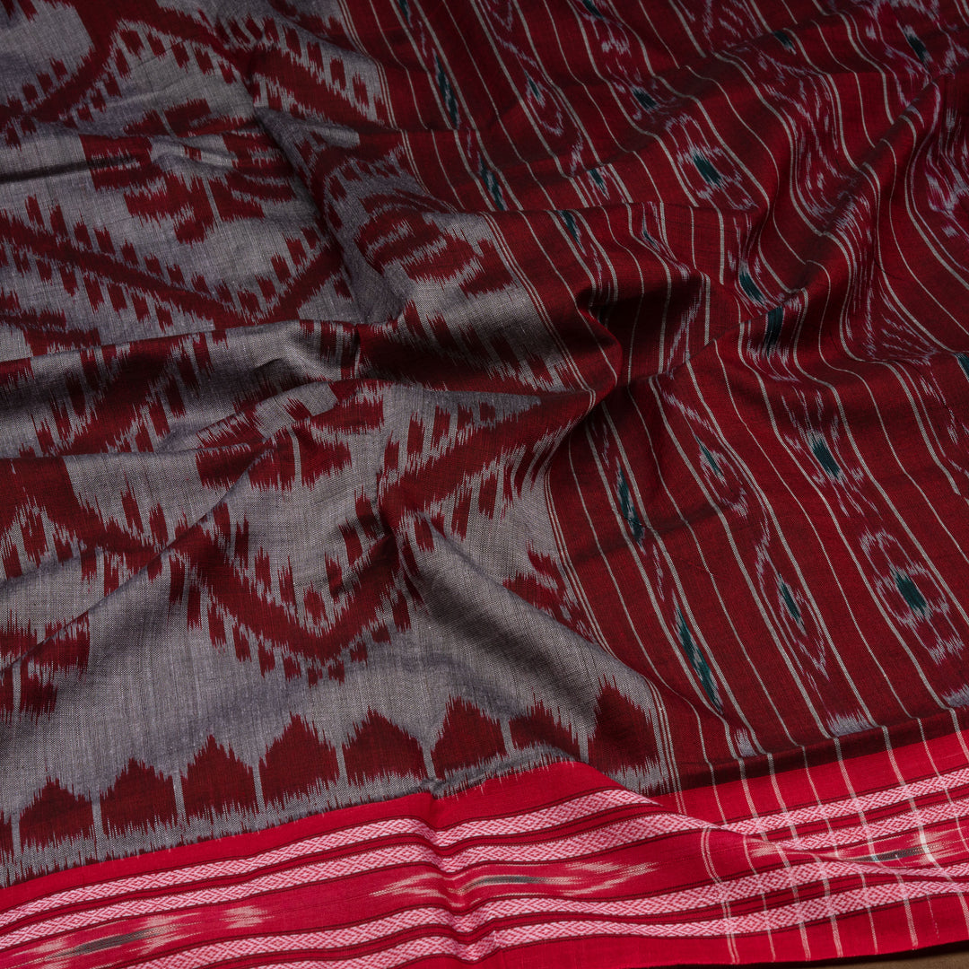 Closeup of Handwoven grey  with maroon pallu ikkat cotton Saree