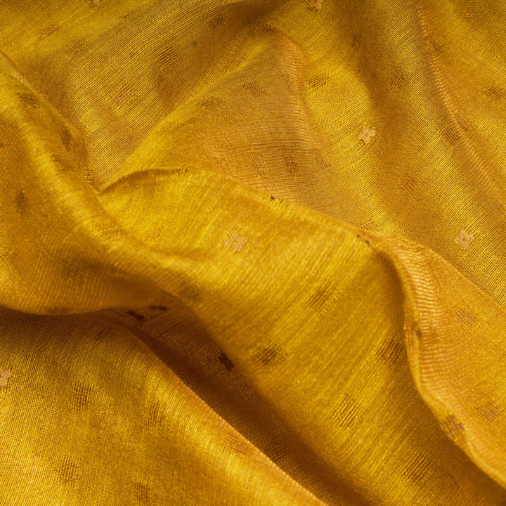 Close-up of yellow fabric with subtle patterns