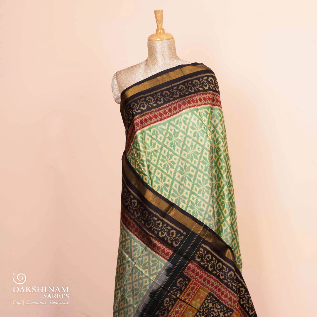 Pleats/body of Handwoven beige and black Ikkat silk Saree