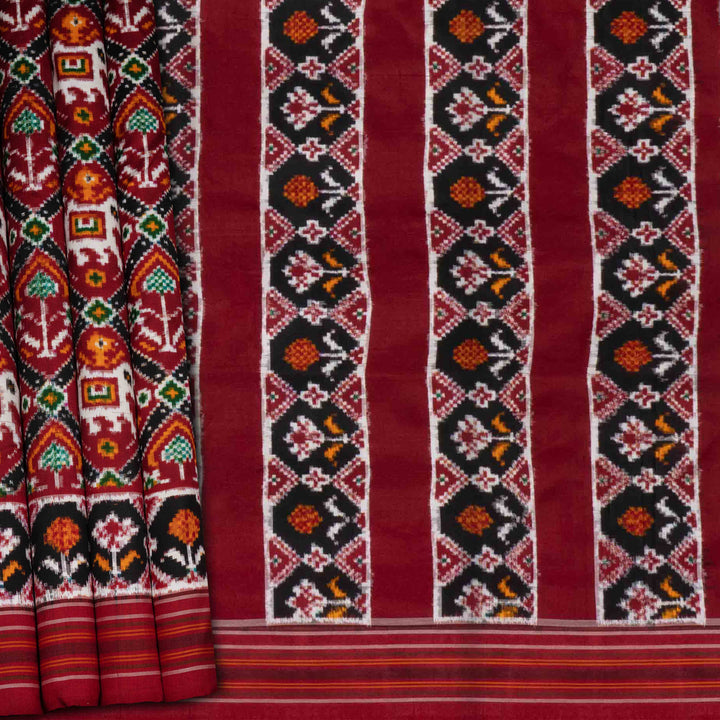 Traditional fabric with intricate patterns on a red background