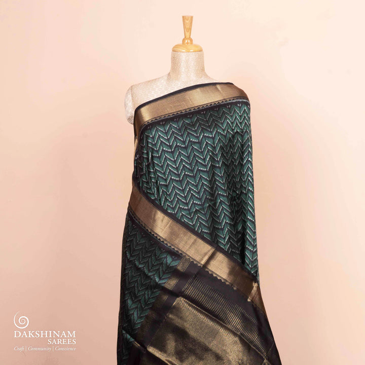 Pleats/body of Handwoven black Ikkat silk Saree