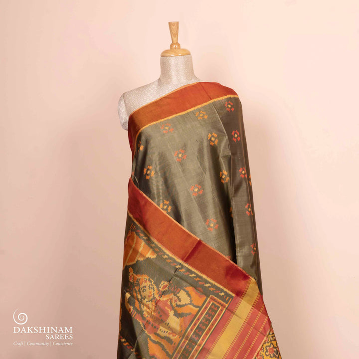 Pleats/body of Handwoven moss grey and orange Ikkat silk Saree