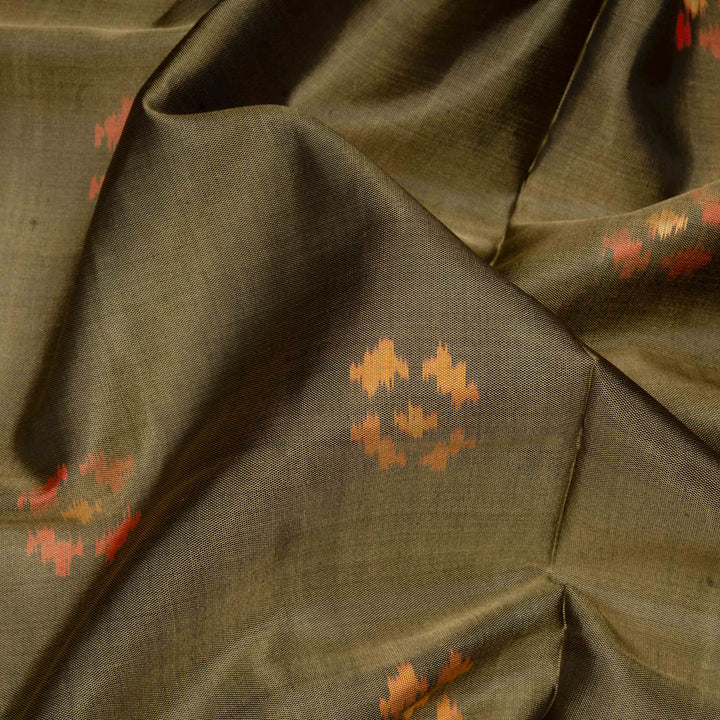 Close-up of olive green fabric with subtle patterns