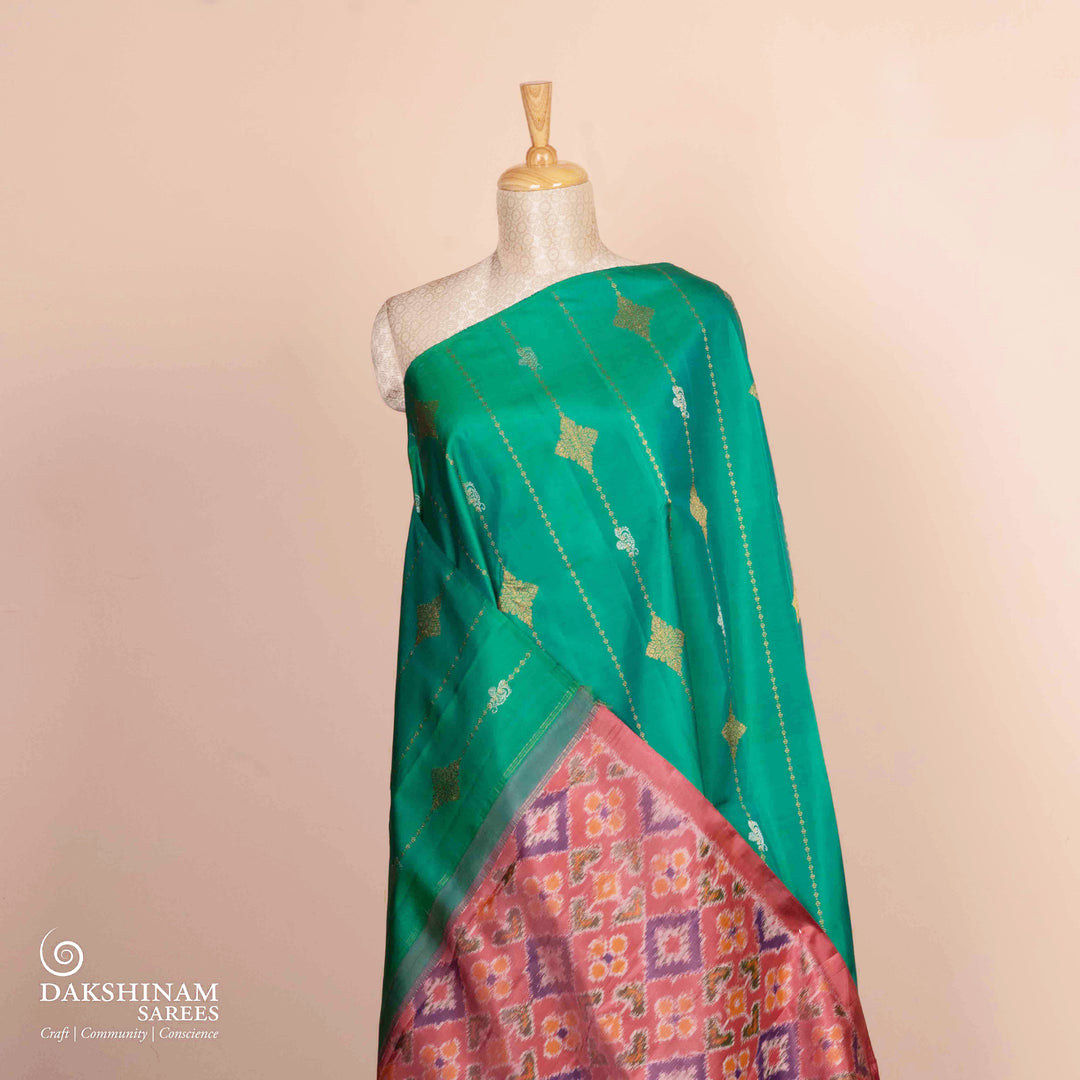 Pleats/body of Handwoven green and pink ikkat kanjivaram silk Saree