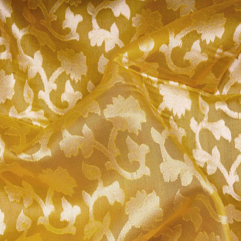 Close-up of gold fabric with intricate floral pattern
