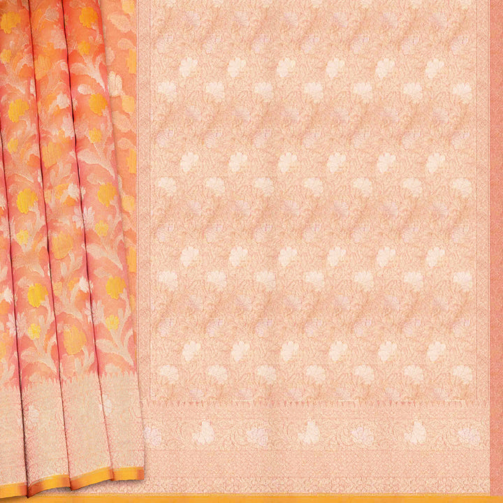 Saree with floral border and white dot pattern on peach background