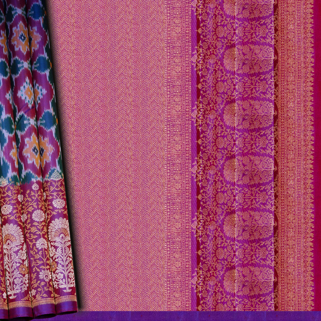 Traditional fabric with intricate patterns on a pink and purple background