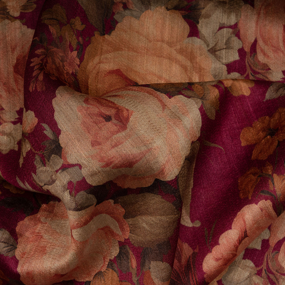 Close-up of floral fabric with pink and orange flowers on a red background