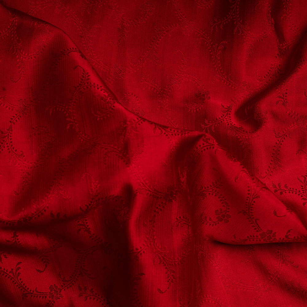 Close-up of red fabric with a subtle pattern