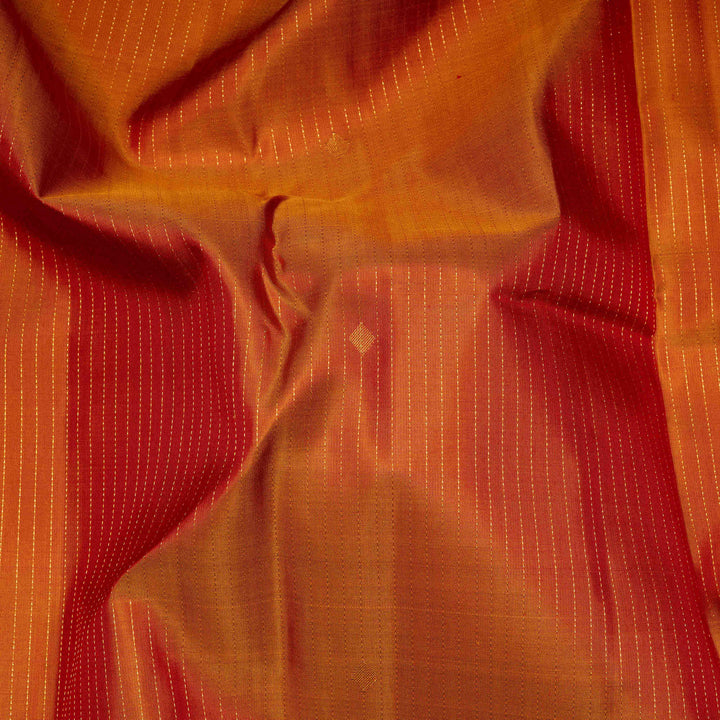 Close-up of orange fabric with a subtle pattern