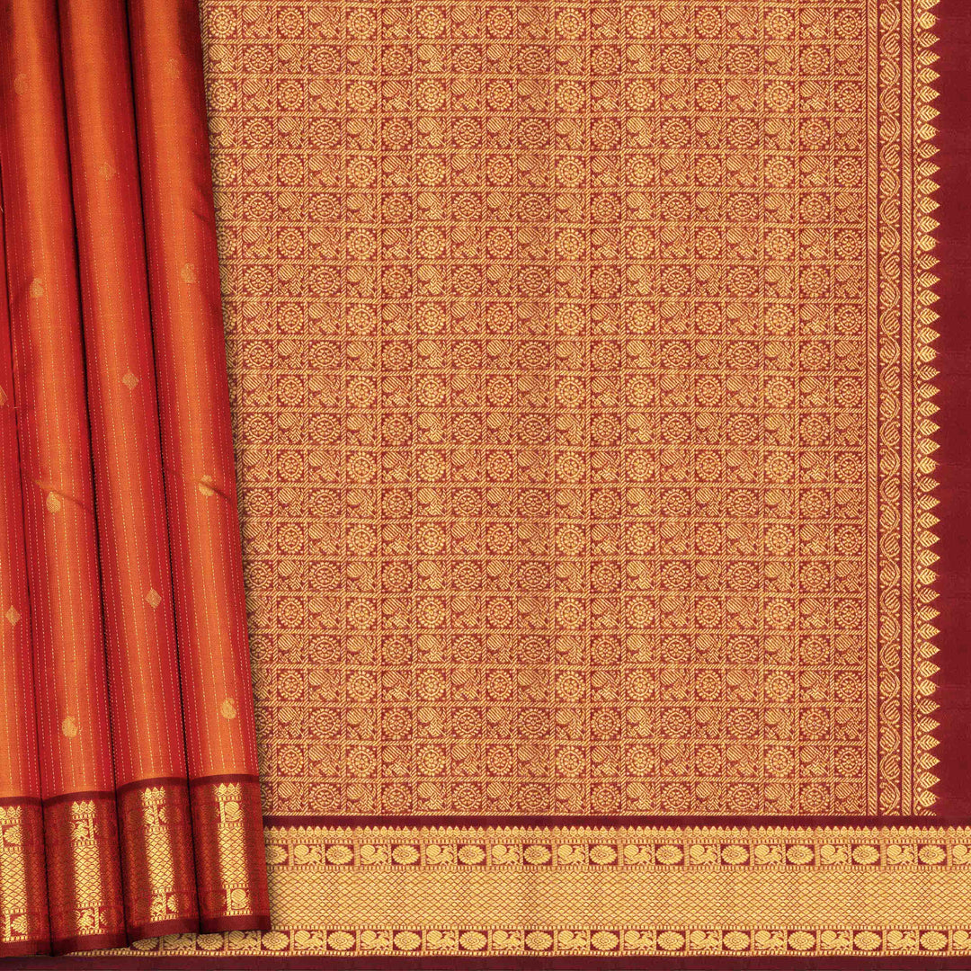 Red and gold patterned fabric with intricate designs
