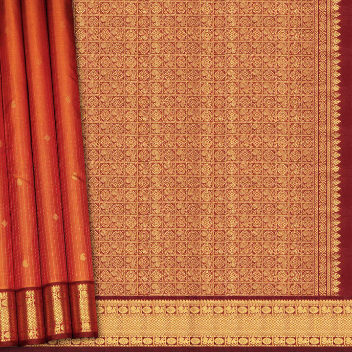 Red and gold patterned fabric with intricate designs