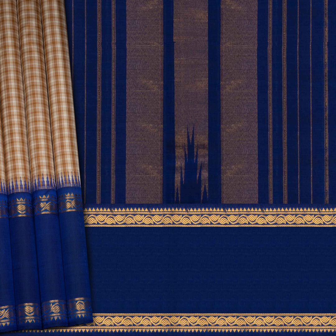 Blue fabric with gold border and pattern, resembling a traditional saree or curtain.