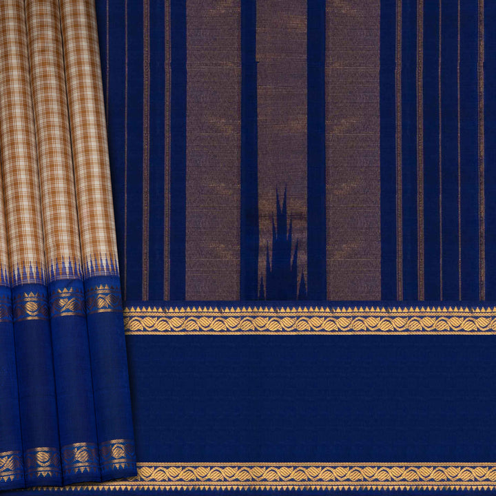 Blue fabric with gold border and pattern, resembling a traditional saree or curtain.