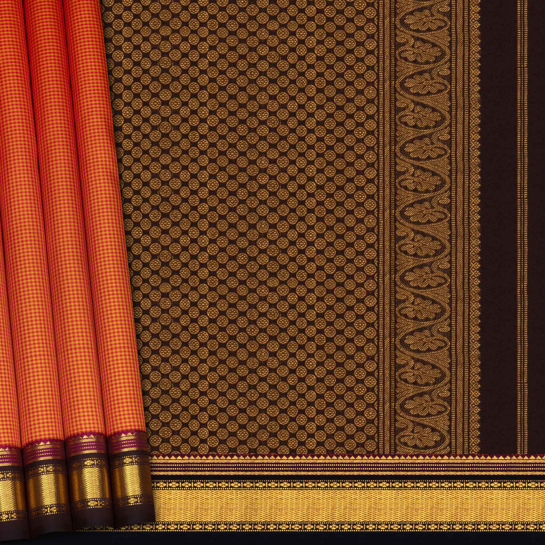 Sari with brown and gold patterned fabric and red border