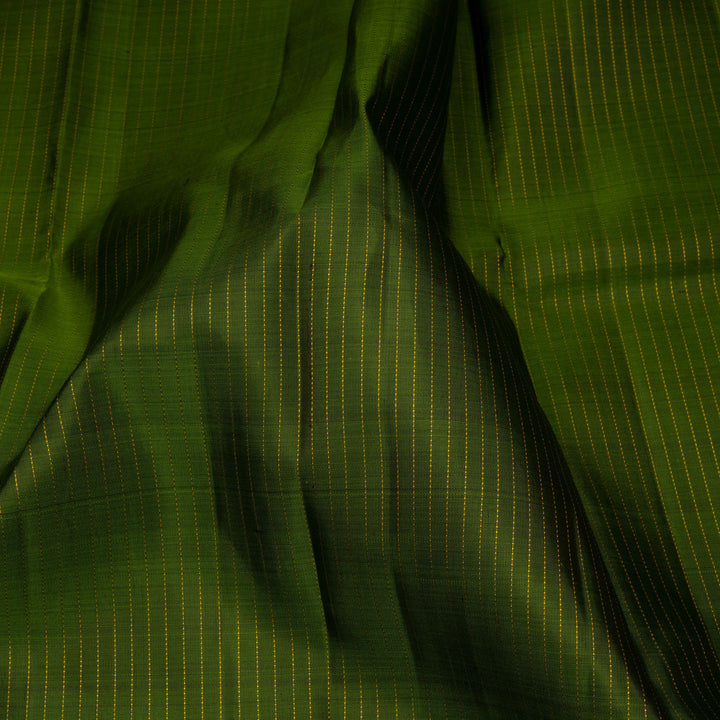 Close-up of green fabric with subtle pattern