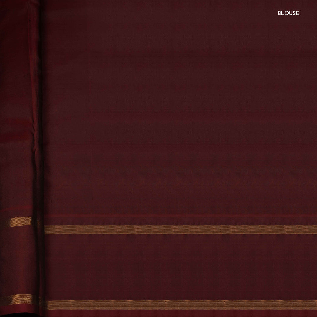 Close-up of maroon fabric with gold stripes, labeled 'BLOUSE'.