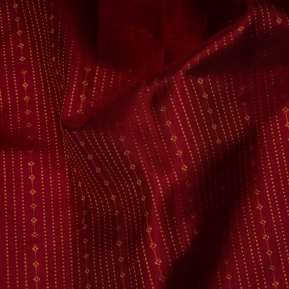 Close-up of a red fabric with gold patterns