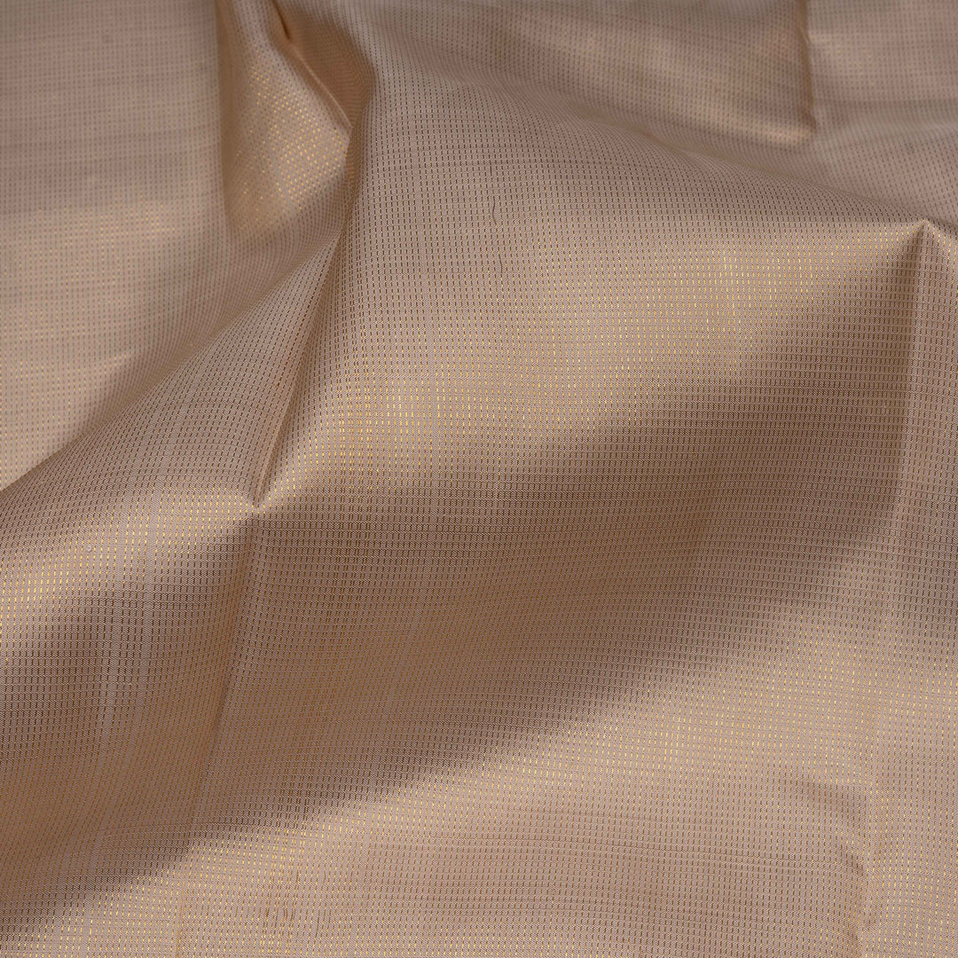 Close-up of beige fabric with a subtle pattern