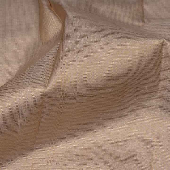 Close-up of beige fabric with a subtle pattern