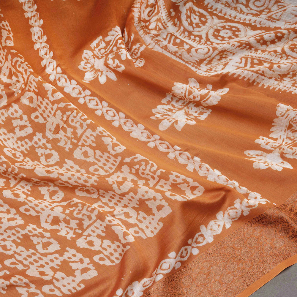 Orange fabric with white intricate patterns