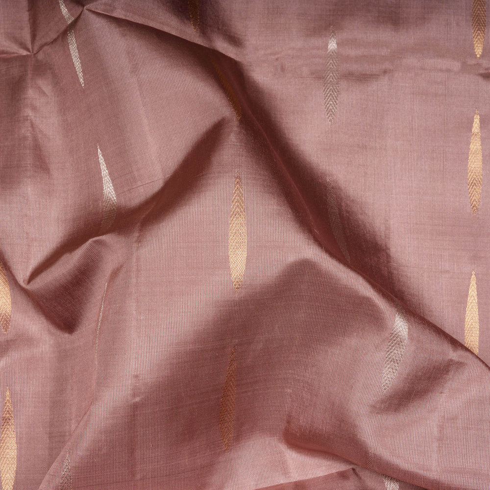 Close-up of pink fabric with gold patterns