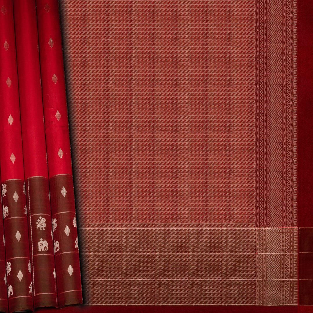Red and brown fabric with intricate patterns on a red background