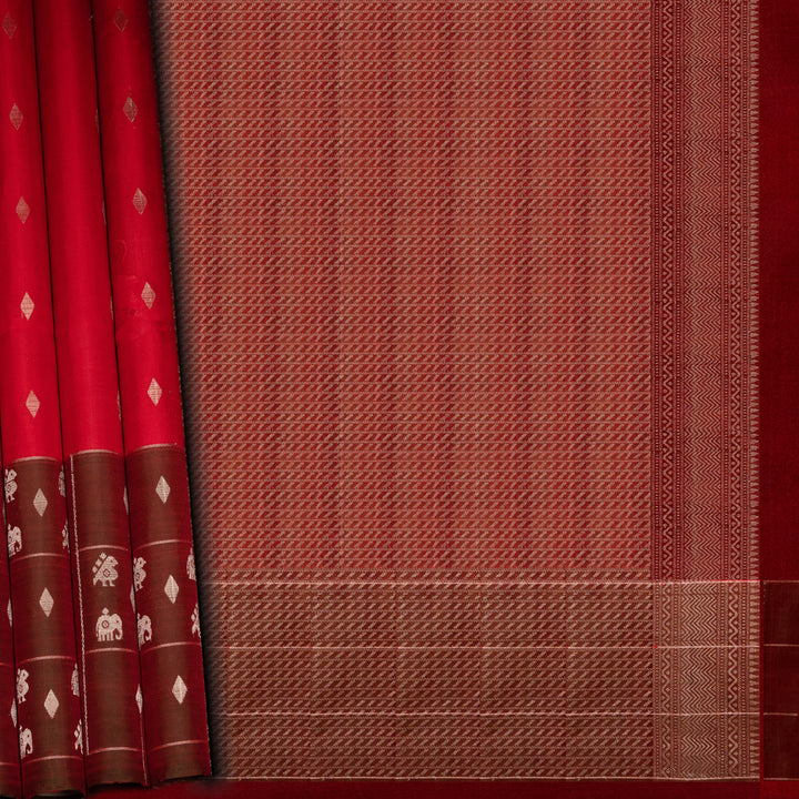 Red and brown fabric with intricate patterns on a red background
