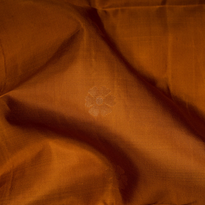 Close-up of brown fabric with a floral pattern