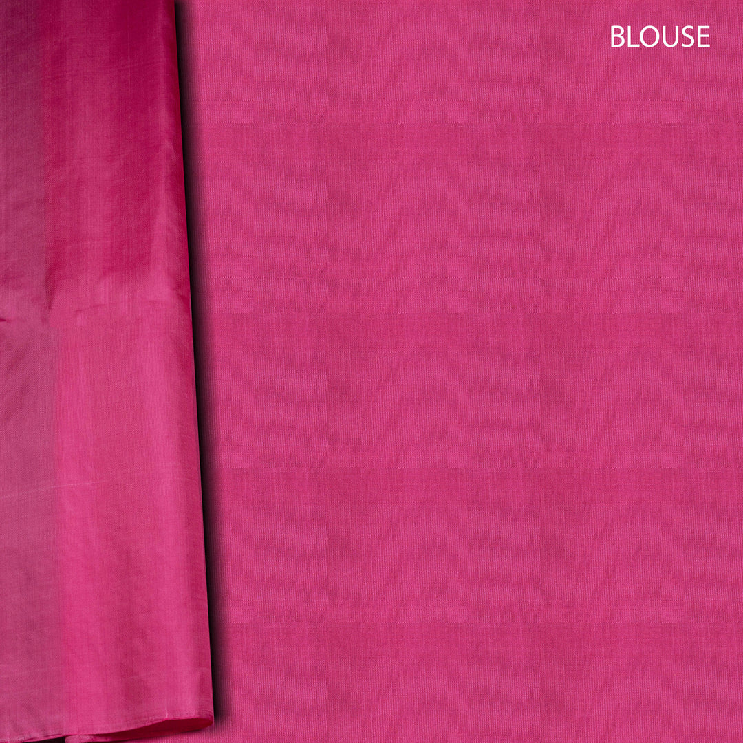 Close-up of pink fabric with 'BLOUSE' text on a white background