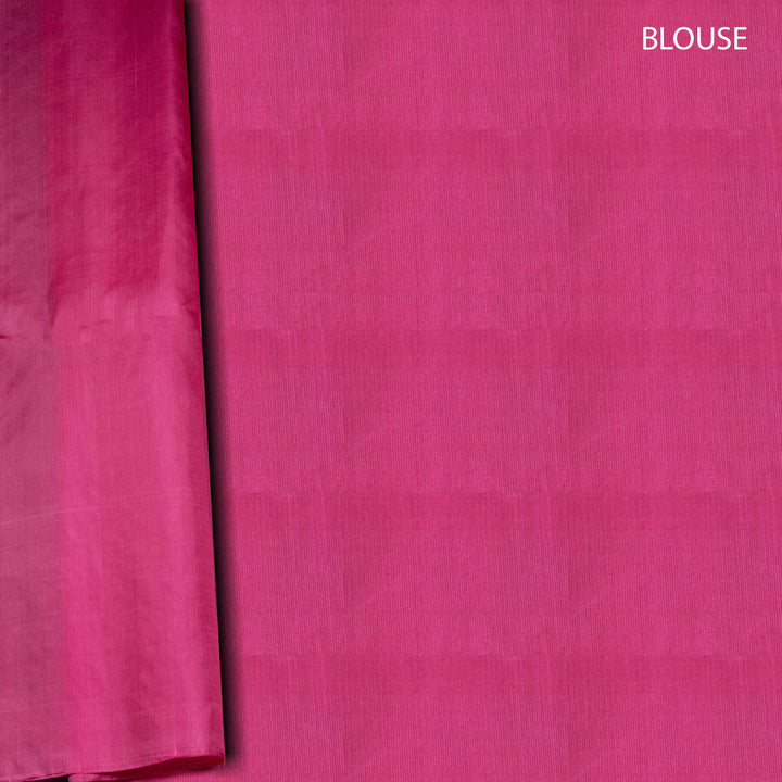 Close-up of pink fabric with 'BLOUSE' text on a white background