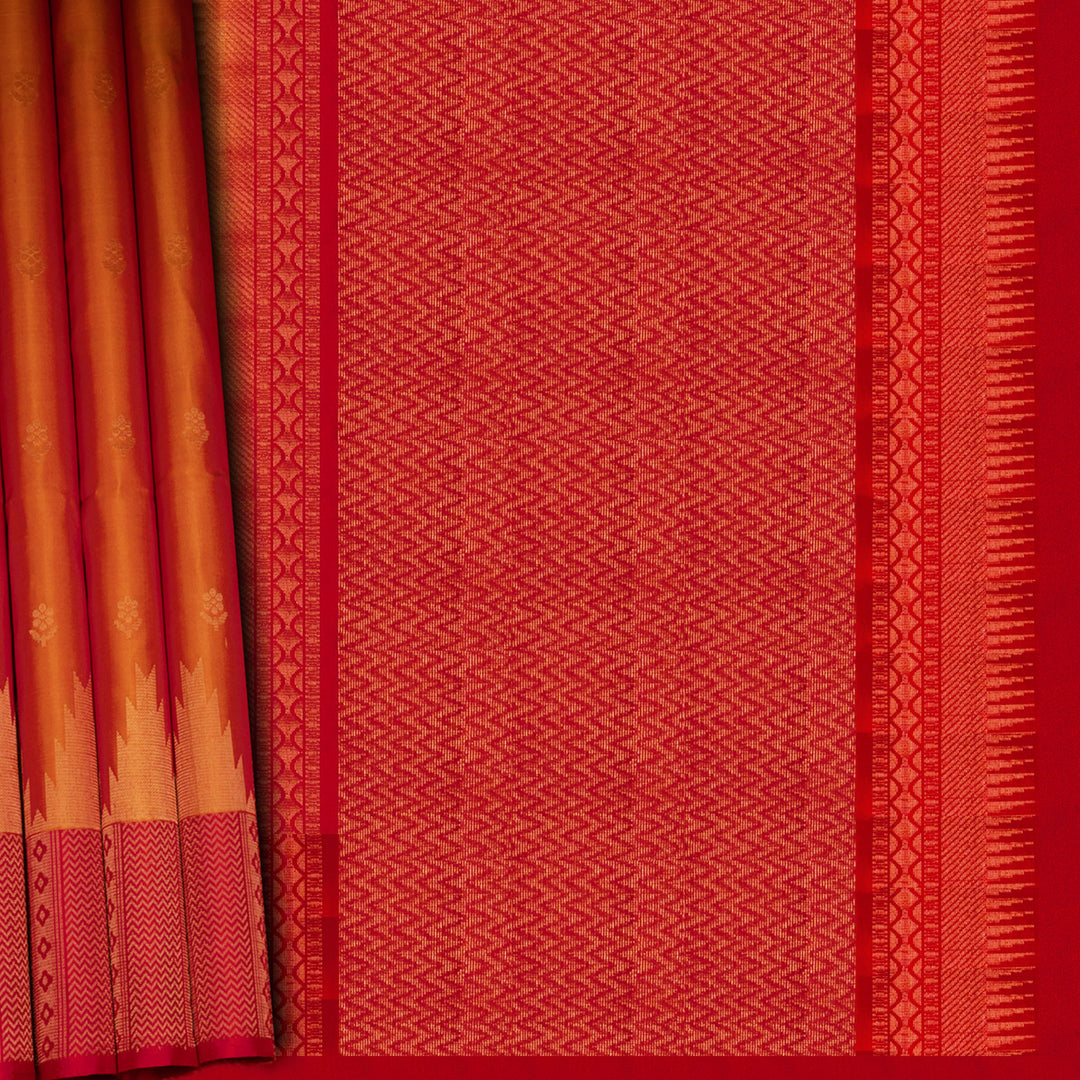 Red and orange traditional fabric with geometric patterns