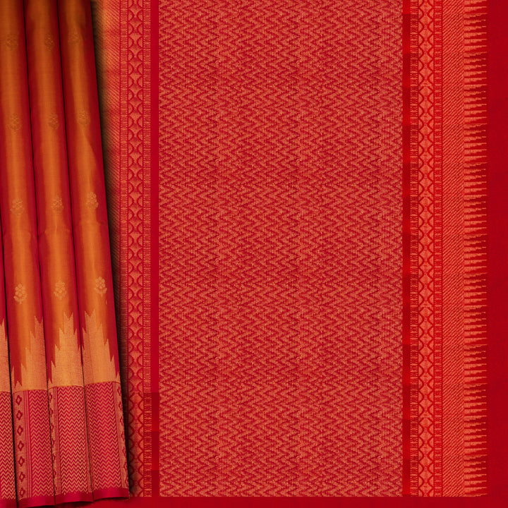 Red and orange traditional fabric with geometric patterns