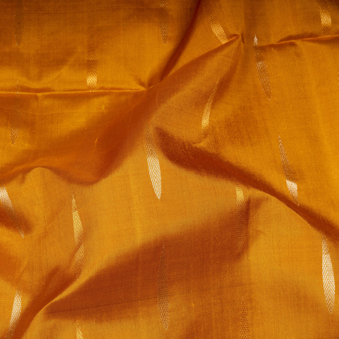 Close-up of orange fabric with subtle patterns