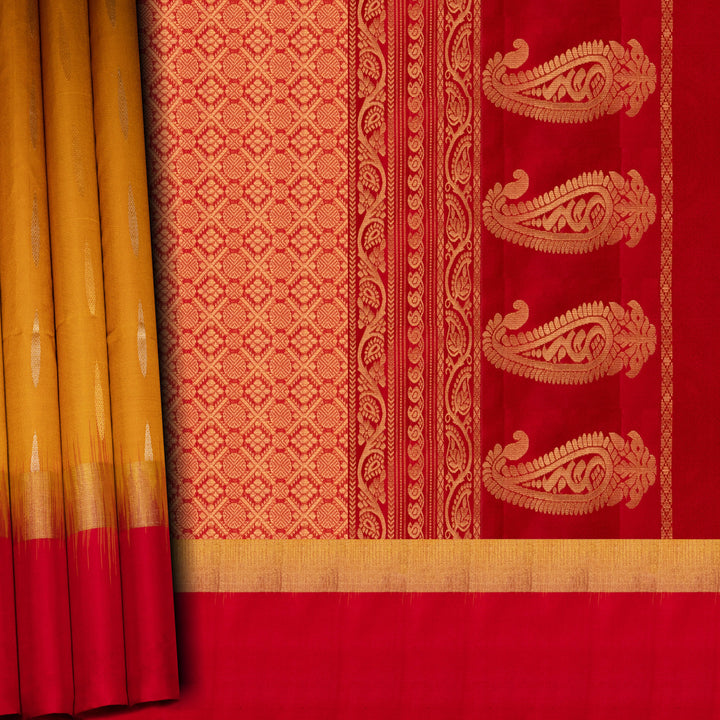 Red and yellow traditional fabric with intricate patterns
