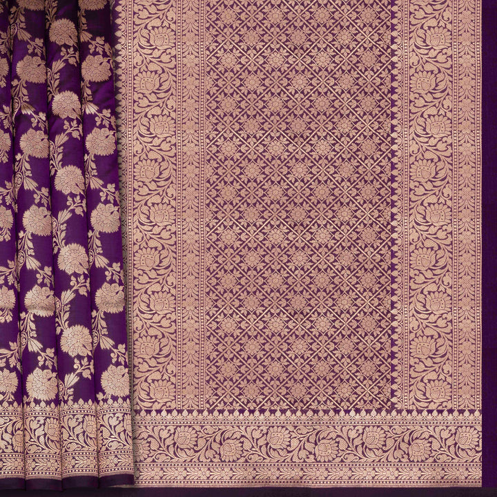 Decorative fabric with intricate patterns in purple and gold