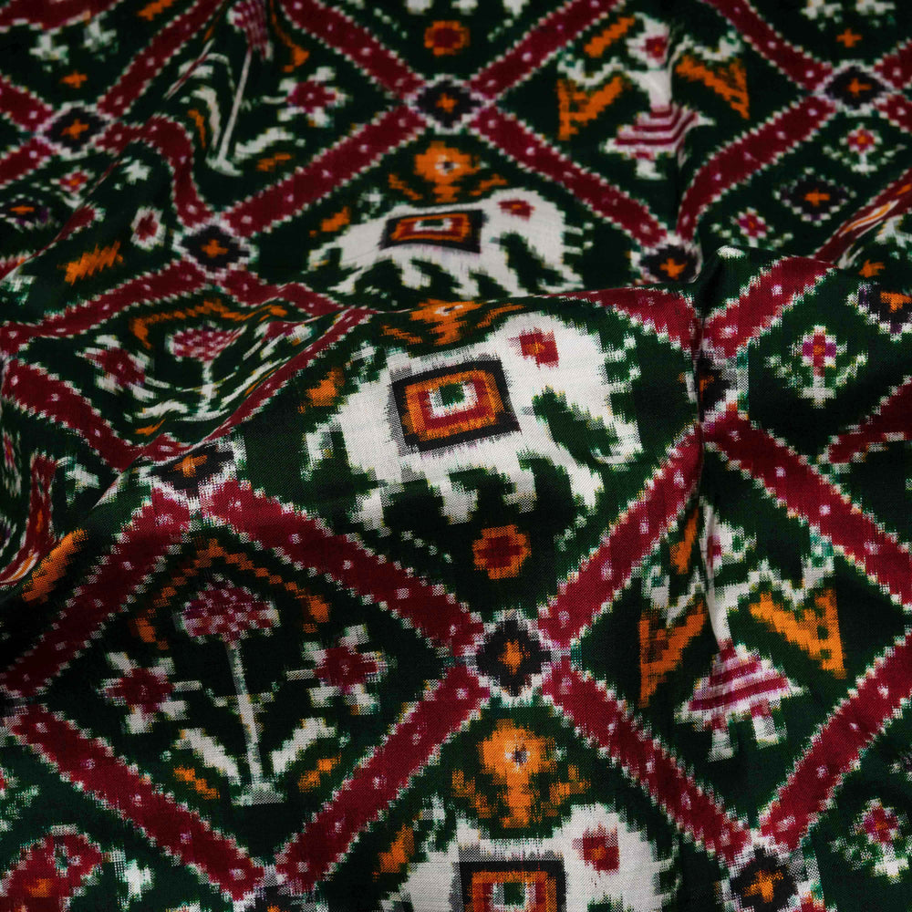 Close-up of a patterned fabric with geometric and floral designs.