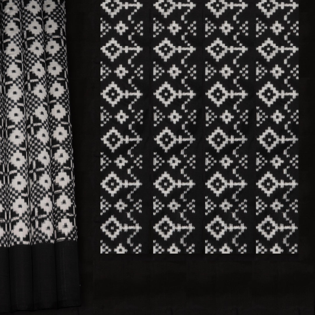 Two black curtains with white geometric patterns on a black background