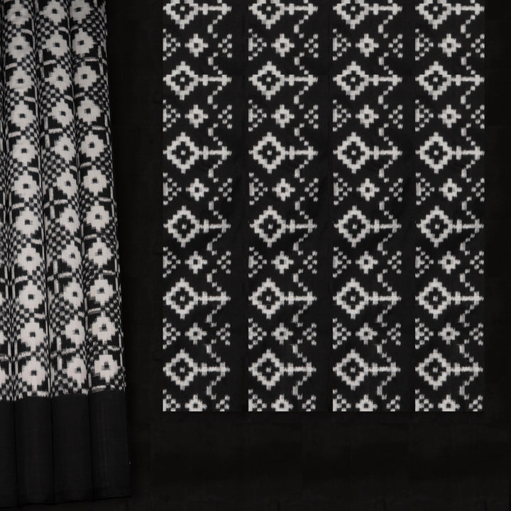 Two black curtains with white geometric patterns on a black background