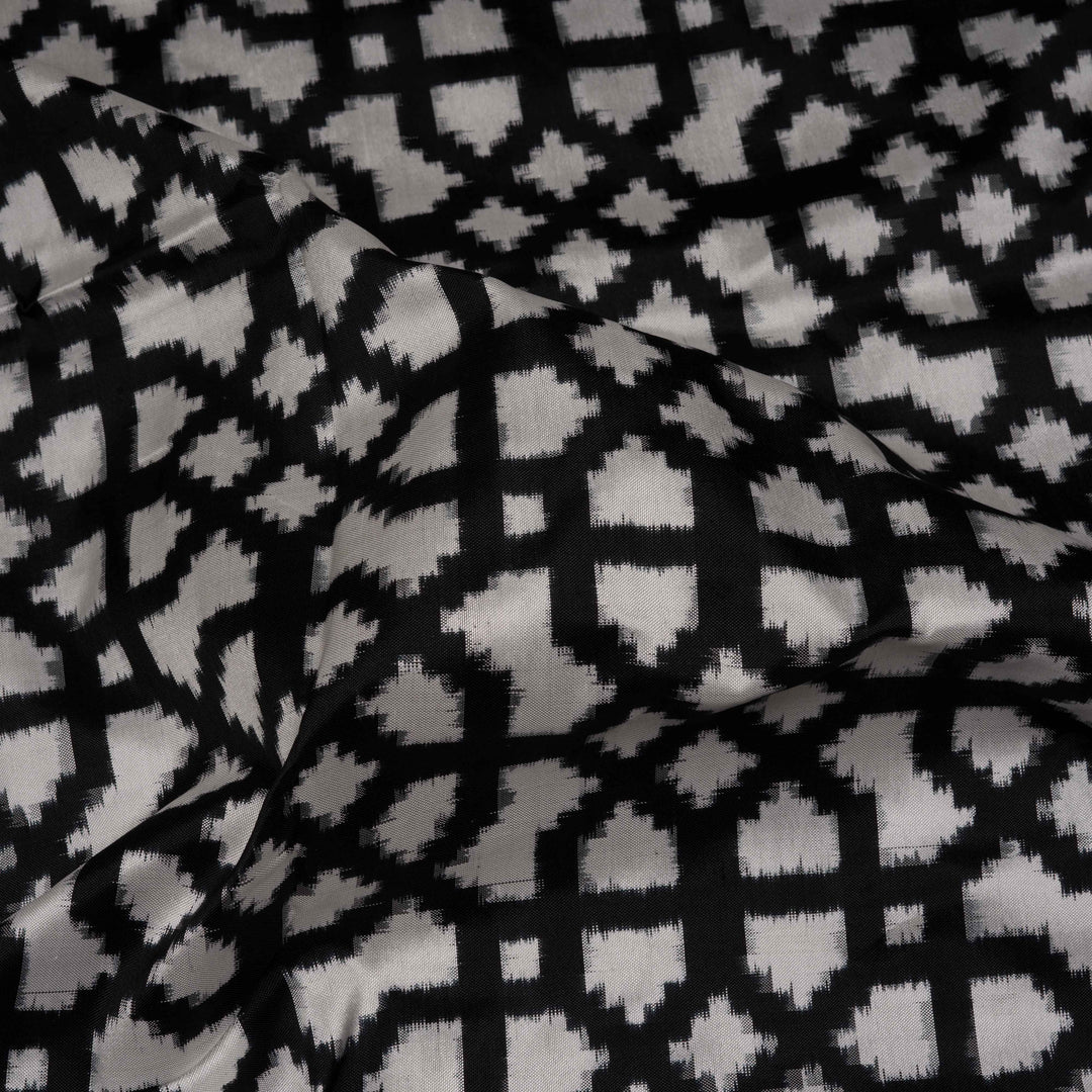 Closeup of Handwoven Black with white Double Ikat silk Saree
