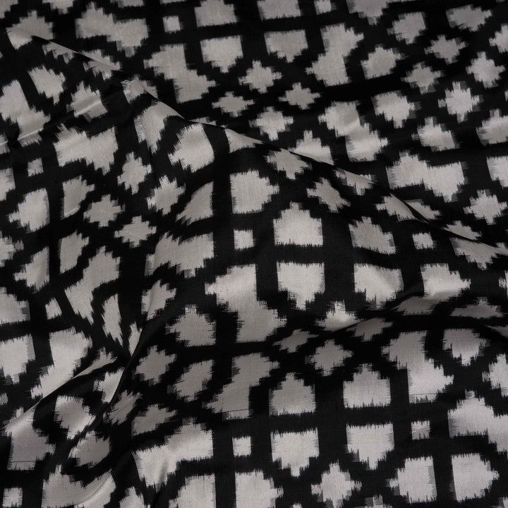 Closeup of Handwoven Black with white Double Ikat silk Saree