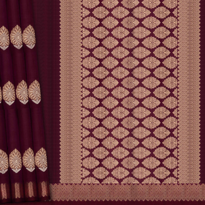 Maroon fabric with gold geometric pattern