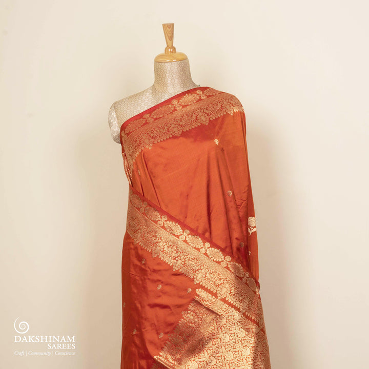 Pleats/body of Handwoven Orange color Mubarakpur Banarasi silk Saree