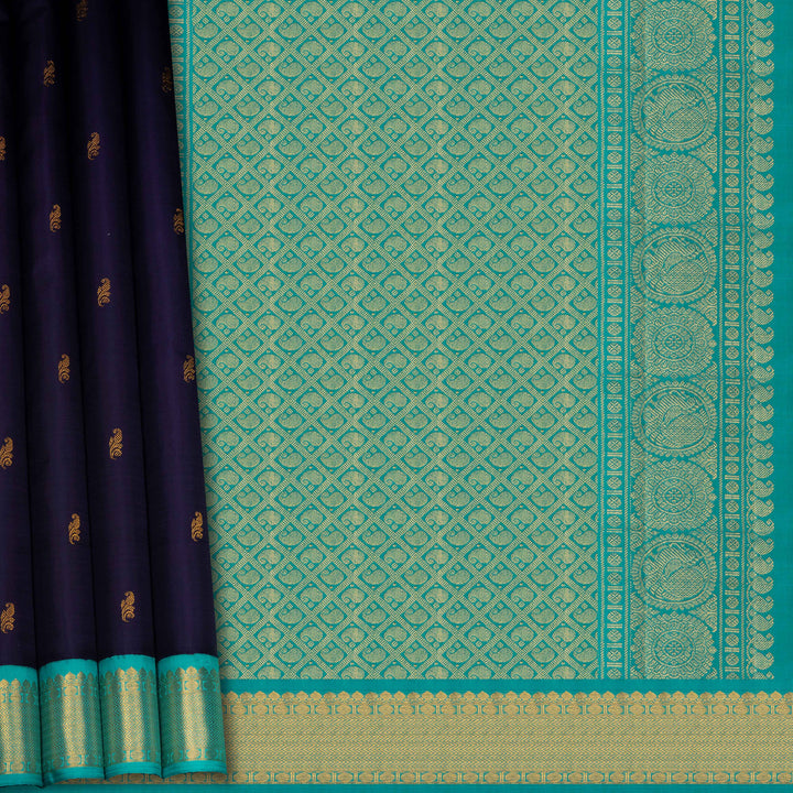 Teal and navy saree with intricate patterns