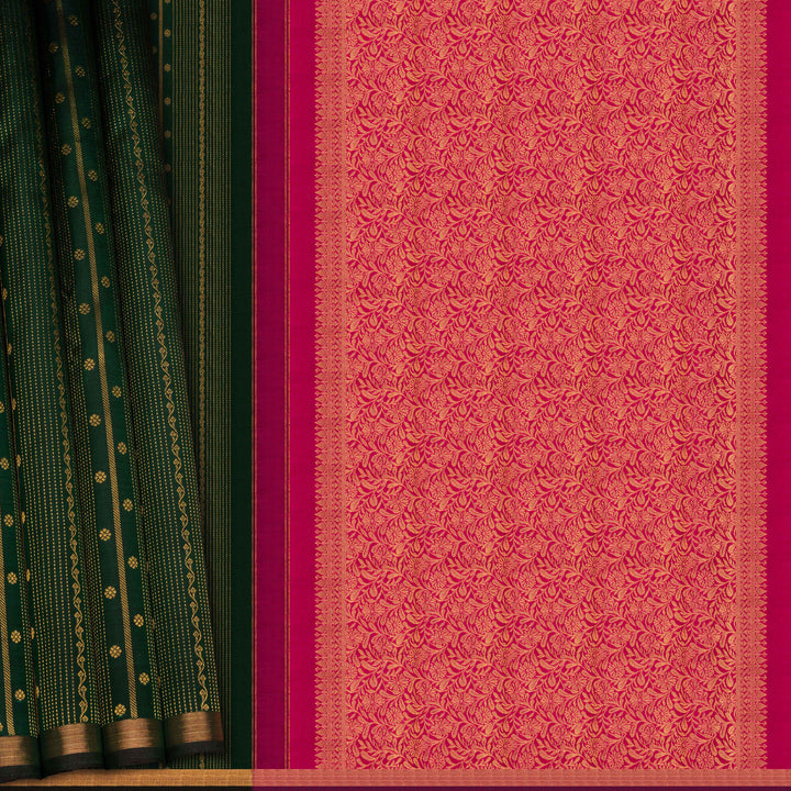 Saree with green and pink patterns on a wooden surface