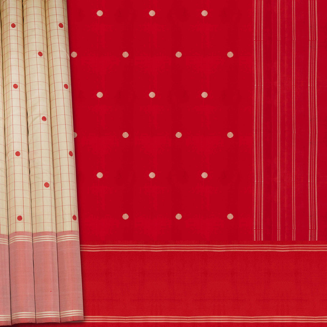Red fabric with white polka dots and a beige curtain with red and white patterns.