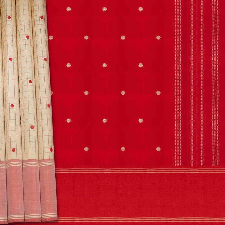 Red fabric with white polka dots and a beige curtain with red and white patterns.